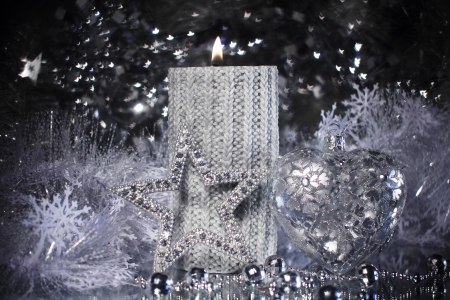 Silver christmas gift and different shiny decorationの写真素材