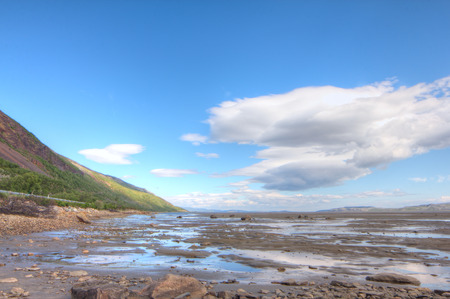 Summer arctic landscape with lake and mountainsの写真素材