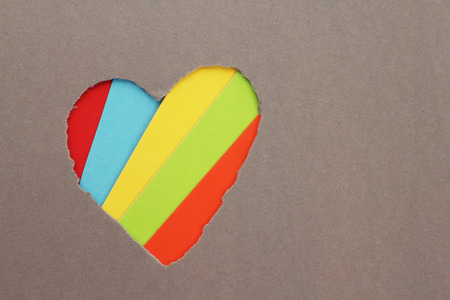 Torn red heart in paper with copy spaceの写真素材