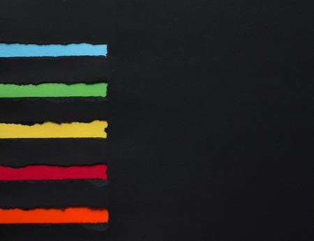 Torn paper banners with space for text on black paper backgroundの写真素材