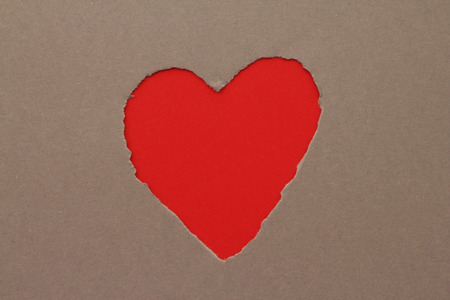 Torn red heart in paper with copy spaceの写真素材