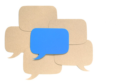 Different opinion concept, paper dialog boxes over whiteの写真素材