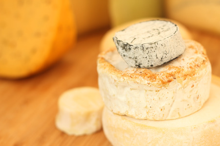 French cheese collection on wooden board with copy spaceの写真素材