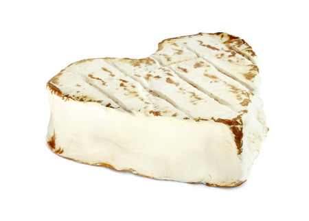 Neufchatel cheese shaped like heart isolated on white backgroundの写真素材