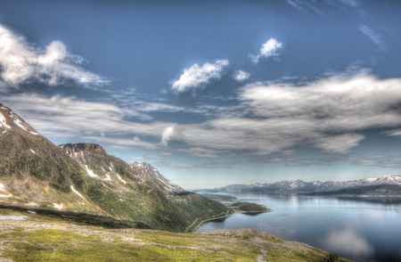 Scenic panorama of fjord on in northern Norway on sunny summer day