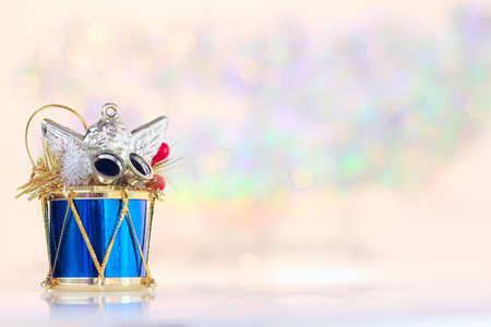 Christmas drum decoration on abstract glowing bokeh backgroundの写真素材