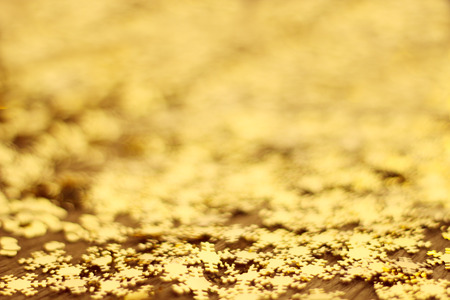 Decorative christmas background with golden decorative snowflakes close-upの写真素材