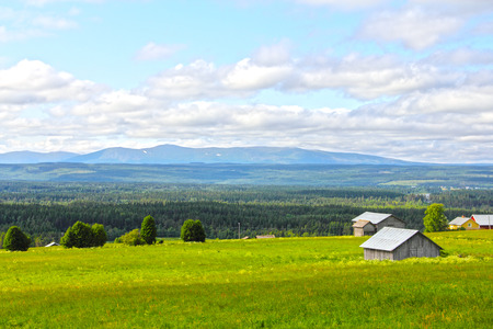 Landscape with mountains and scandinavian village at summerの写真素材