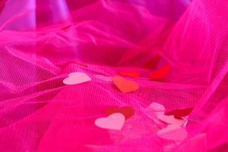 Paper hearts on pink fabric background, Valentine dayの写真素材