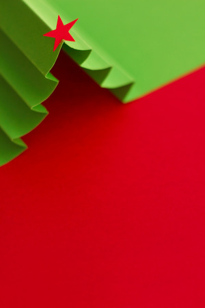 Creative design of christmas background with paper fir treeの写真素材