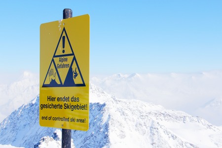 Danger sign in winter alpine mouintains close up