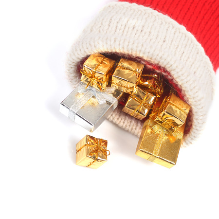 Red Christmas sock with gifts isolated on white background