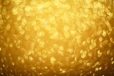 Abstract gold bokeh background of glowing lights, party, holiday, christmasの写真素材