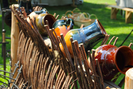 Clay jugs on wicher handmade fence, traditional Latvian styleの写真素材