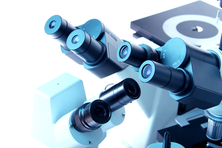 Group of various Microscopes in blue medicine lightの写真素材