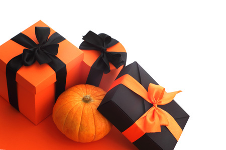 Halloween pumpkin and gifts isolated on white background, corner composition with copy spaceの写真素材