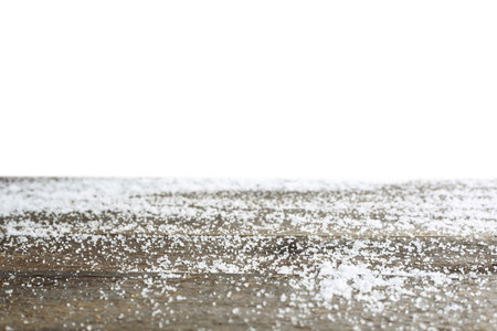 Wooden table with snow, copy space for text, isolated on white backgroundの写真素材