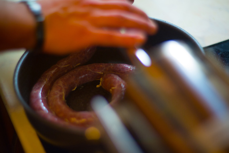 Close up of process of making homemade sausage at home with pressure machineの写真素材