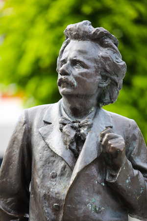 Sculpture of the famous Norwegian composer Edvard Grieg near Grieg Hall in Bergen, Norwayの写真素材
