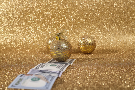 Christmas money gift on abstract gold glitters bokeh backgroundの写真素材
