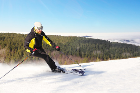 Skier skiing downhill in morning mountains, resort Spindleruv Mlyn, Krkonose, Czech Republicの写真素材