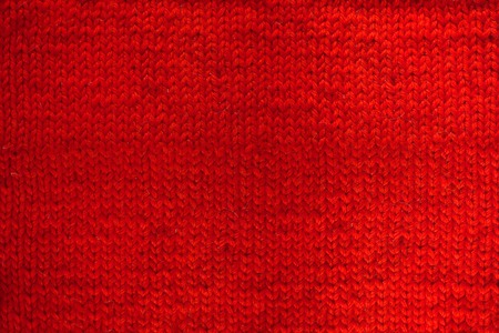 Red knitted woolen background with copy space for textの写真素材