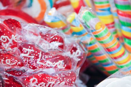 Many colorful candies in store color bright background lollipopの写真素材