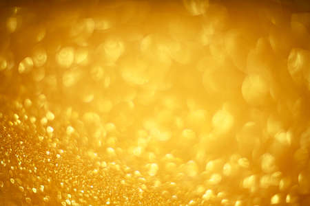 Abstract gold bokeh background of glowing lights, party, holiday, christmasの写真素材