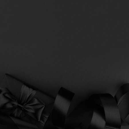 Black friday sale background with gift present box and curly ribbon with copy space for text adの写真素材