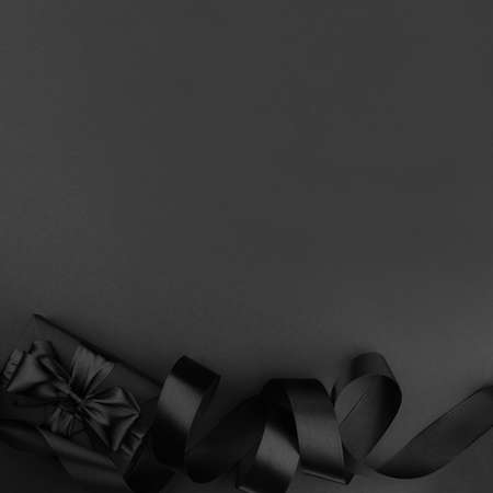 Black friday sale background with gift present box and curly ribbon with copy space for text adの写真素材