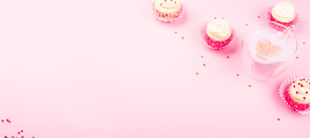 Heart shape love drink cup, latte coffee milk love potion milkshake concept and cupcakes on pink background with copy space for textの写真素材