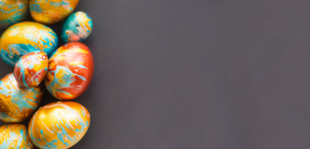 Perfect colorful handmade easter eggs on gray paper background, shape of border frame corner with copy space for text content, happy easter cardの写真素材