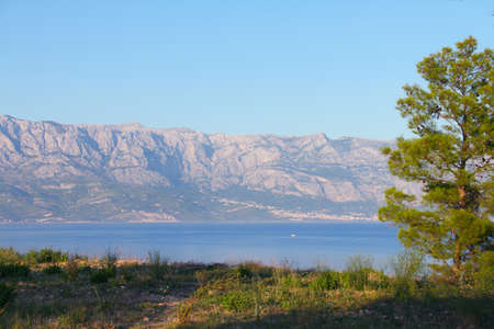 Turquoise sea water of beach and mountains, Sumartin, Brac island, Croatiaの写真素材