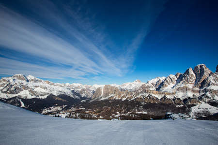 Dolomities Dolomiti Italy in wintertime beautiful alps winter mountains and ski slope Cortina d'Ampezzo Faloria skiing resort areaの写真素材