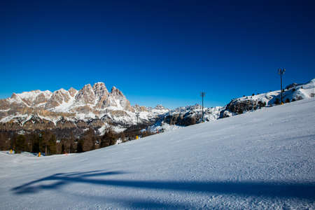 Dolomities Dolomiti Italy in wintertime beautiful alps winter mountains and ski slope Cortina d'Ampezzo Faloria skiing resort areaの写真素材