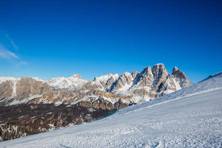 Dolomities Dolomiti Italy in wintertime beautiful alps winter mountains and ski slope Cortina d'Ampezzo Faloria skiing resort areaの写真素材