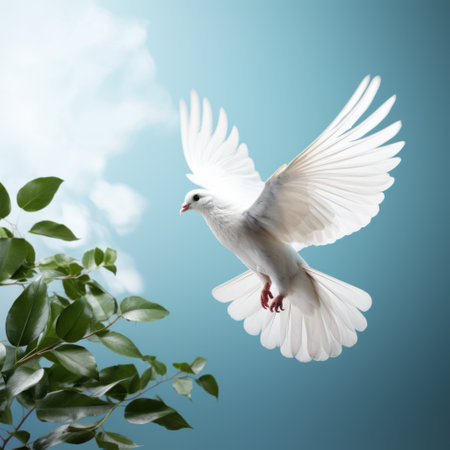 Flying white dove with green leaves on blue sky background. Freedom conceptの素材