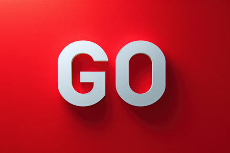 Red Wall With a White Go Signの素材