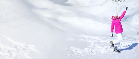 Banner of ski pistes and white mountain with young woman in pink ski jacket, white gloves, hat and...