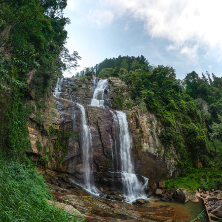 Fisheye wide shot of Ramboda Fall waterfall, Pussellawa Sri Lankaの写真素材