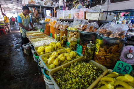 Khao Lak, Thailand - February 22, 2016: Variety of fresh fruit and vegetables products displayed on local food market in the morning. Thai cuisine is renowned for its tasty food ingredients.のeditorial素材