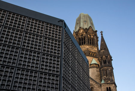 Berlin, Germany - September 09, 2007: Broken tower of Kaiser Wilhelm Memorial Church (Gedachtniskirche) with belfry in front - church was not rebuild as a reminder of world war II.のeditorial素材