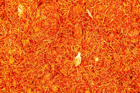 Top view, detail of bright orange red dried saffron (Crocus sativus) flowers spice displayed on food market, Kyrenia, Northern Cyprusの写真素材