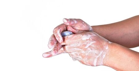 Young man washing hands with blue soap bar, isolated on white. Can be used during coronavirus...