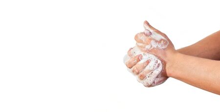 Young man wash hands with soap, closeup detail on soap bubbles, isolated on white empty space for...