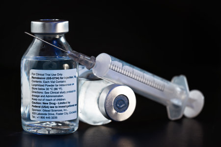 Liptovsky Hradok, Slovakia - May 18, 2020: Remdesivir label on vaccine bottles (concept, not real product). GS-5734 is antiviral drug developed Gilead Sciences, possible covid 19 cureのeditorial素材