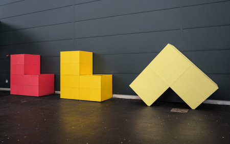 London, United Kingdom - February 05, 2019: Luton Airport sign (Letters LLA made from colourful cubes) in front of departure hall wall. LTN is 5th busiest in United Kingdom.のeditorial素材