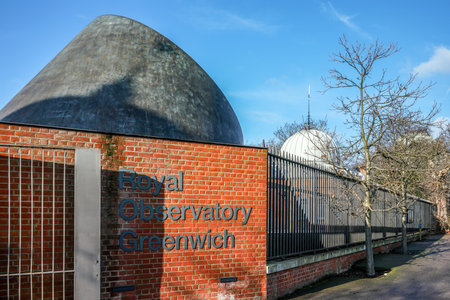 London, United Kingdom - February 02, 2019: Royal Observatory Greenwich label on brick wall near entrance, RGO, commissioned 1675 is best known for prime meridian that passes through.のeditorial素材