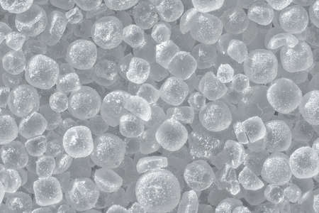 White table salt crystals under microscope, image width 9mm, abstract science background