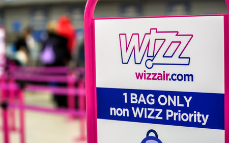 London, United Kingdom - February 05, 2019: Wizzair info table about maximum baggage size, blurred...